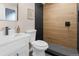 Sleek bathroom boasting a modern vanity, updated fixtures, and tiled shower at 8051 Clarkson Ct, Denver, CO 80229