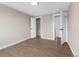 Spacious bedroom with wood floors and doorways leading to closet and bathroom at 8051 Clarkson Ct, Denver, CO 80229