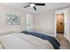 Comfortable bedroom featuring a ceiling fan, closet, and an en suite bathroom at 8051 Clarkson Ct, Denver, CO 80229
