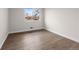 Simple bedroom with hardwood floors, natural light, and fresh paint at 8051 Clarkson Ct, Denver, CO 80229