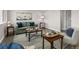 Well-decorated living room with a sofa, chair, modern decor, hardwood floors, and great lighting at 8051 Clarkson Ct, Denver, CO 80229