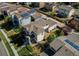 Backyard aerial view with deck, outdoor seating, lush landscaping and neighborhood at 10152 Southlawn Cir, Commerce City, CO 80022