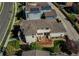 Aerial view showcasing backyard deck, patio, lush lawn and surrounding neighborhood at 10152 Southlawn Cir, Commerce City, CO 80022