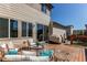 Inviting back deck with comfortable seating and a grill, ideal for outdoor gatherings and relaxation at 10152 Southlawn Cir, Commerce City, CO 80022