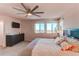 Spacious bedroom features a large window with beautiful views, creating a serene and inviting atmosphere at 10152 Southlawn Cir, Commerce City, CO 80022
