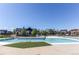 Community pool with zero entry and chairs, ready for relaxation at 10152 Southlawn Cir, Commerce City, CO 80022
