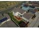 Aerial view of the back of the home, featuring a wood deck and landscaped backyard at 10152 Southlawn Cir, Commerce City, CO 80022