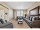 Living room with neutral walls, hardwood floors, and gray sofas at 12274 Tamarac St, Thornton, CO 80602