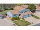 Overhead view of a home featuring a brick facade, attached garage, lush landscaping, and a well-maintained yard at 835 S Geneva St, Aurora, CO 80247