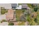 An aerial shot of an empty lot next to a one-story home at 835 S Geneva St, Aurora, CO 80247