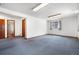 Finished basement space with multiple doors and large window at 835 S Geneva St, Aurora, CO 80247