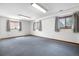 Bright basement area featuring large windows and neutral decor at 835 S Geneva St, Aurora, CO 80247