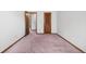 Bedroom showcasing multiple doors and wall to wall carpet at 835 S Geneva St, Aurora, CO 80247