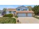 Lovely two-story home with brick accents, two-car garage, well-kept landscaping, and a welcoming front entrance at 835 S Geneva St, Aurora, CO 80247