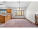 Open space with natural light, seamlessly connects the kitchen and dining areas, enhancing the sense of space at 835 S Geneva St, Aurora, CO 80247