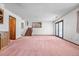 Bright, expansive living room area with staircase and sliding glass doors at 835 S Geneva St, Aurora, CO 80247