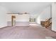 Bright and airy living room offering high ceilings and an open layout with views and a staircase at 835 S Geneva St, Aurora, CO 80247
