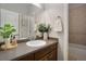 Clean bathroom with a sink, tub, and stylish fixtures at 11886 E Fair Ave, Greenwood Village, CO 80111