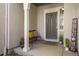 Charming front porch featuring a welcoming bench, plants, and a 'Welcome' sign at 11886 E Fair Ave, Greenwood Village, CO 80111