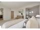Bright main bedroom showcasing calming paint colors and a peaceful sitting area at 11886 E Fair Ave, Greenwood Village, CO 80111