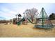 Community playground with multiple play structures and soft wood chip ground covering at 11886 E Fair Ave, Greenwood Village, CO 80111