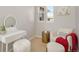 Sitting area features a chair, vanity, ottoman and decor at 11886 E Fair Ave, Greenwood Village, CO 80111