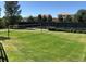 Community volleyball court featuring a net and lush green grass at 11886 E Fair Ave, Greenwood Village, CO 80111
