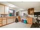 Basement area features a utility sink, cabinets, shelving and exercise equipment at 4231 S Fairplay Cir # A, Aurora, CO 80014