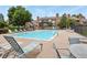 Inviting community pool surrounded by lounge chairs, offering a relaxing outdoor experience at 4231 S Fairplay Cir # A, Aurora, CO 80014