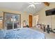 Spacious bedroom with vaulted ceilings and access to a private outdoor patio at 4231 S Fairplay Cir # A, Aurora, CO 80014