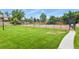 Well-maintained community tennis court surrounded by lush greenery and a paved pathway at 4231 S Fairplay Cir # A, Aurora, CO 80014