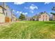 Sprawling backyard with lush green grass and mature trees, perfect for outdoor activities and relaxation at 1662 S Blackhawk Way # A, Aurora, CO 80012