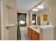 Cozy bathroom with wooden cabinets and a mirror at 1662 S Blackhawk Way # A, Aurora, CO 80012