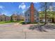 Inviting townhome featuring a classic brick chimney and a well-maintained front yard at 1662 S Blackhawk Way # A, Aurora, CO 80012