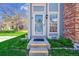 Close-up of front door showing detailed trim and landscaping at 1662 S Blackhawk Way # A, Aurora, CO 80012