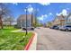 Neighborhood street view featuring well-maintained townhomes and ample parking spaces for residents and guests at 1662 S Blackhawk Way # A, Aurora, CO 80012