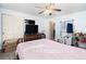 Bright bedroom with a bed, closet, tv, and room for storage at 1143 Lamar St # 6, Lakewood, CO 80214