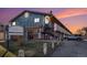 Charming condo building with brick and blue siding, well-maintained landscaping, and a community sign at 1143 Lamar St # 6, Lakewood, CO 80214