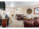 Inviting living room featuring neutral carpet, comfortable seating, and access to the dining area at 1143 Lamar St # 6, Lakewood, CO 80214