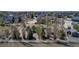 Wide aerial shot of a lot with a white fence and a house in the background, located in a neighborhood at 3545 Cottonwood Cir, Longmont, CO 80504
