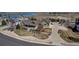 Stunning aerial shot of a home with well-manicured landscaping and a long driveway near a lake at 3545 Cottonwood Cir, Longmont, CO 80504