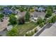 Expansive backyard featuring a patio area, mature landscaping, and a white fence at 3545 Cottonwood Cir, Longmont, CO 80504