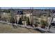 Large fenced backyard with trees offering privacy and a view of neighboring homes at 3545 Cottonwood Cir, Longmont, CO 80504