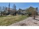 Expansive backyard featuring a pergola-covered patio and lush green lawn at 3545 Cottonwood Cir, Longmont, CO 80504