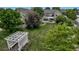 Expansive backyard with lush lawn, mature trees, patio, and pergola at 3545 Cottonwood Cir, Longmont, CO 80504