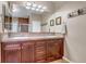 Luxurious bathroom with a double sink vanity, decorative mirrors, and tiled backsplash at 3545 Cottonwood Cir, Longmont, CO 80504