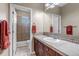 This bathroom features a single vanity and a tiled shower with a glass door at 3545 Cottonwood Cir, Longmont, CO 80504