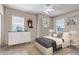 Bright bedroom featuring a ceiling fan, neutral walls, and modern furniture at 3545 Cottonwood Cir, Longmont, CO 80504