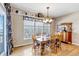 Formal dining room featuring hardwood floors and large windows at 3545 Cottonwood Cir, Longmont, CO 80504