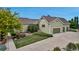Charming home featuring a three car garage, well-manicured lawn, and beautiful landscaping at 3545 Cottonwood Cir, Longmont, CO 80504